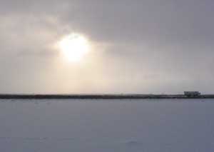 A Tundra Buggie Heads for home as the Sun Begins
 to Set